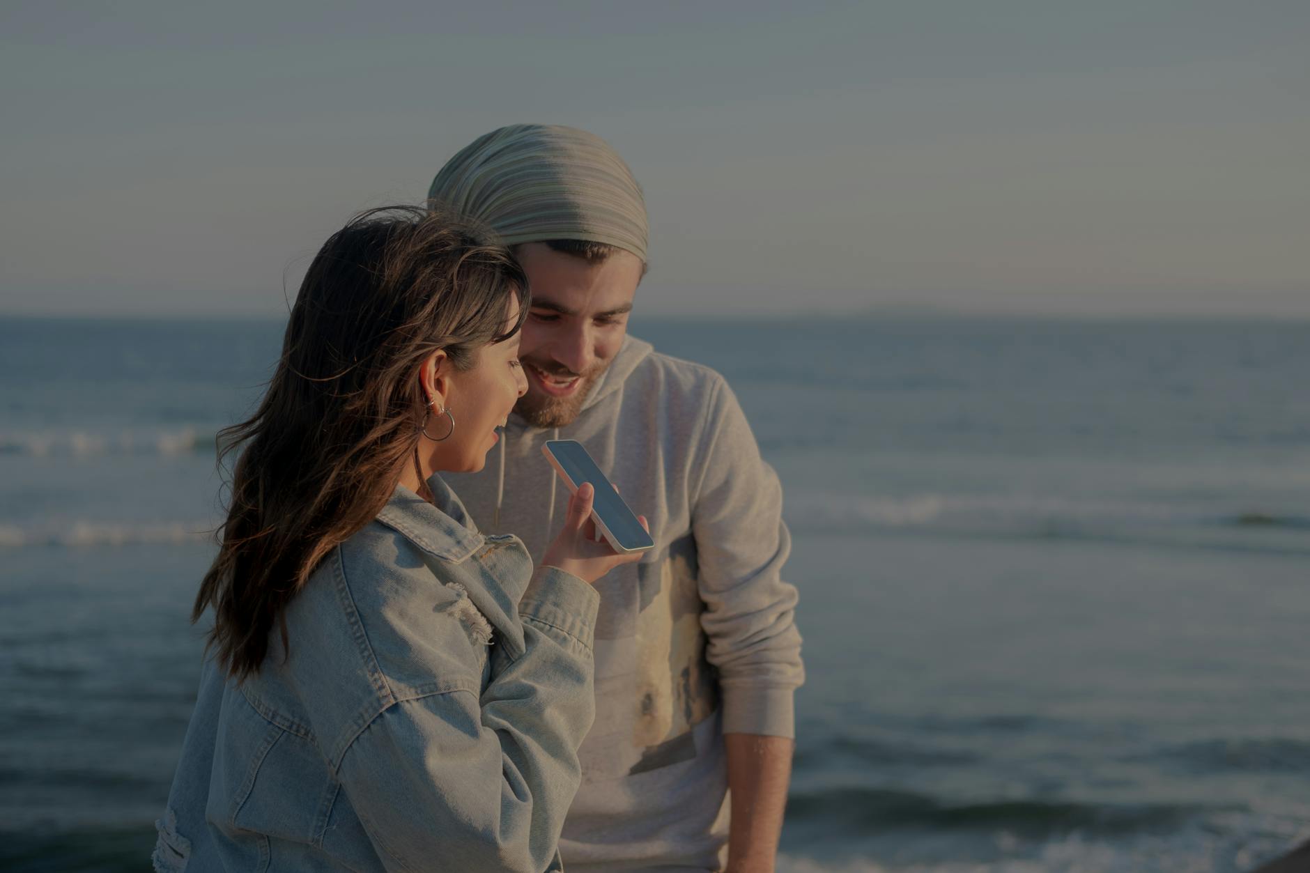 a man and woman talking on the phone together